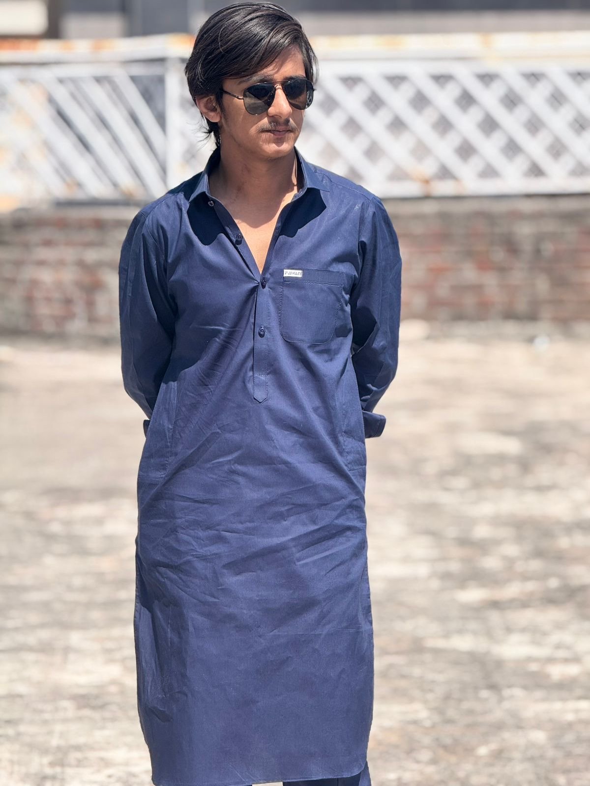 Hamza Malik - Director & CEO